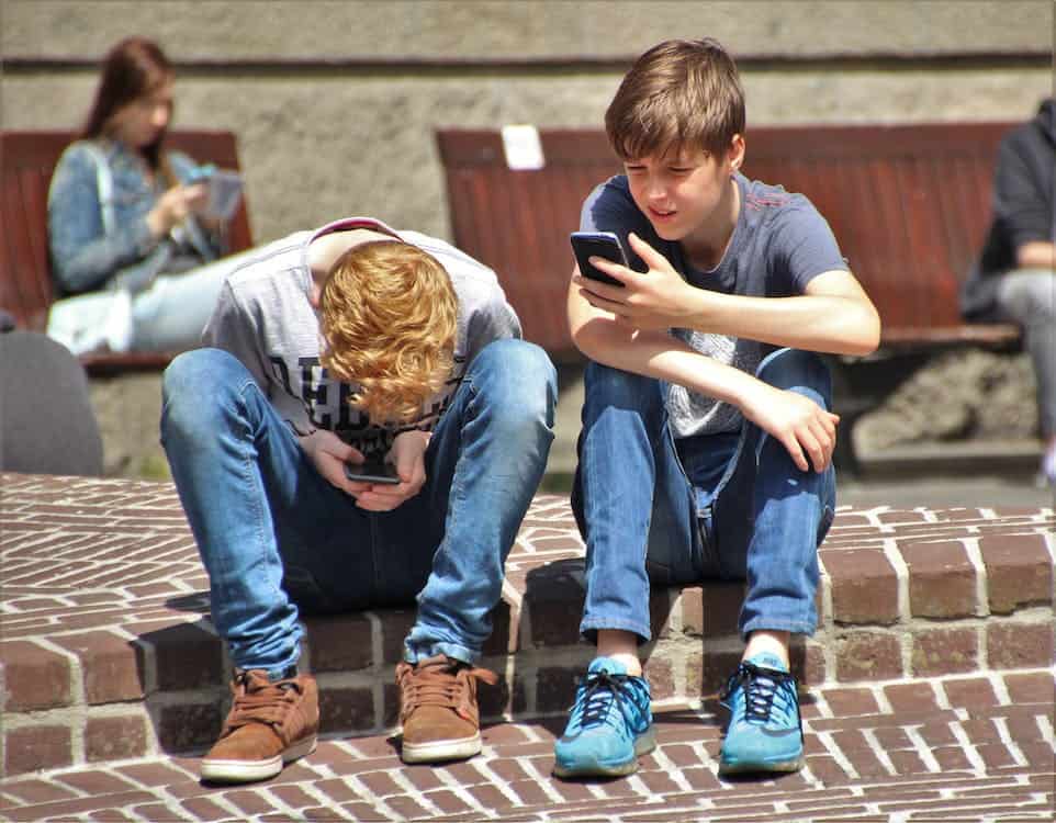 teenagers using their phone