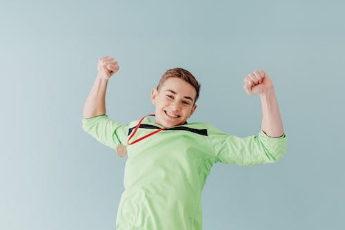 Teenage boy with a medal